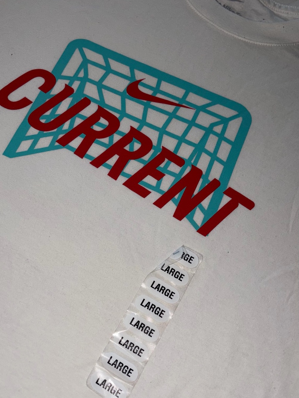 Nike White Tee with Red "CURRENT" and Teal Net Graphic